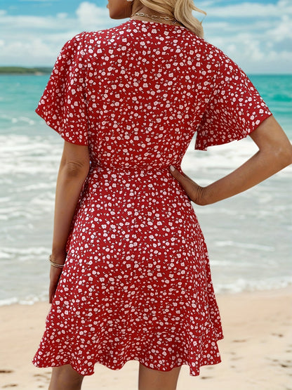 Luchtige Dames Zomerjurk met Bloemenprint en Elegante Overslag Pasvorm